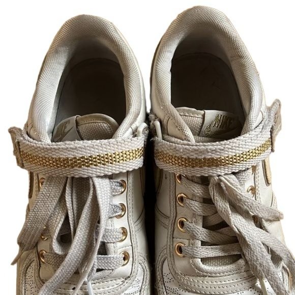 white and gold nike sneakers